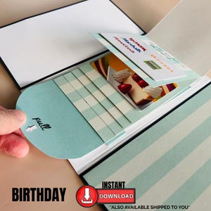 May include: A birthday-themed gift card holder with a light blue and white gingham pull tab. The holder contains gift cards from TJ Maxx, Marshalls, HomeGoods, and Sierra. The word "Birthday" is printed at the bottom.