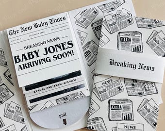 May include: A white cardstock announcement featuring a newspaper theme with black text reading The New Baby Times, Breaking News, Baby Jones Arriving Soon, and Due April 2020. A pull tab reveals a hidden section, and a belly band reads Breaking News.