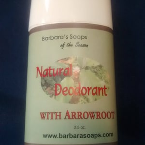 May include: A white deodorant stick with a green label that reads "Barbara's Soaps of the Season Natural Deodorant WITH ARROWROOT 2.5 oz. www.barbarasoaps.com".