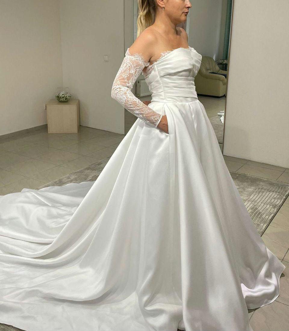 long sleeve diamond wedding dress Azazie 2026 Ball-Gown Boho White Traditional Wedding Dress Lace Chapel Train Lace V-Neck With Pockets