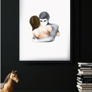 May include: Framed art print featuring a watercolor illustration of two figures embracing. One figure is depicted in grayscale, the other in natural skin tones. The artwork is set against a white background.