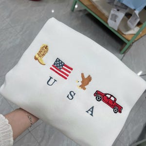 USA Embroidered Icons Crewneck Sweatshirt | America Sweatshirt | 4th of July crewneck | Country, Western, Cowboy Sweatshirt | G18EFJ2