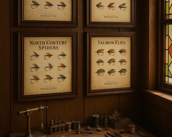 May include: Four framed vintage fishing fly prints, labeled Trout Flies, Sea Trout Flies, North Contury Spiders, and Salmon Flies. A wooden table displays fly tying tools, including scissors, thread spools, and feathers. The room has a warm, rustic ambiance.
