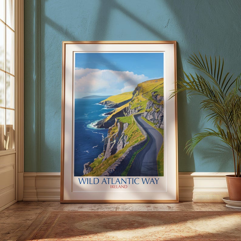 a framed poster of the Wild Atlantic Way in Ireland, with a scenic coastal landscape depicting a winding road along the cliffs overlooking the ocean.