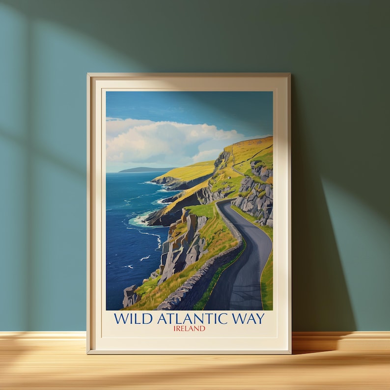 The image is a framed poster depicting the Wild Atlantic Way in Ireland, with a winding road leading along the edge of a cliff overlooking the ocean.