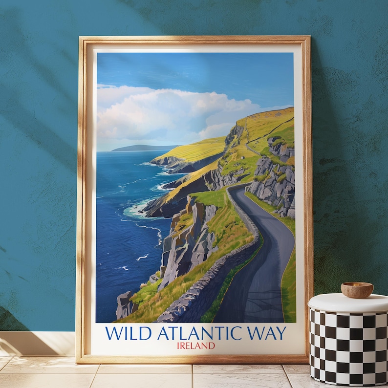 a framed poster of the "Wild Atlantic Way" in Ireland, depicting a winding road along the rugged coastline with cliffs and the ocean in the background.