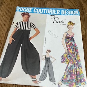 May include: Vintage Vogue Couturier Design sewing pattern for a Pucci of Italy jumpsuit. The pattern shows three different styles of jumpsuits, one with a striped top and black pants, one with a solid black top and black pants, and one with a colorful print.