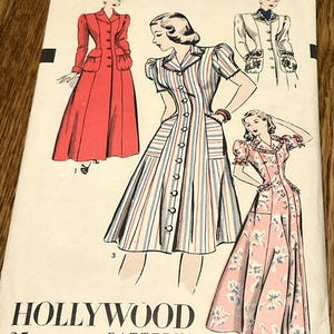 May include: Vintage Hollywood Patterns sewing pattern from 1946. The pattern features illustrations of dresses and coats. The cover is cream-colored with illustrations in red, blue, and pink. The text "HOLLYWOOD PATTERNS" is printed at the bottom.