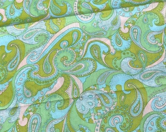 May include: A fabric with a paisley pattern in shades of green and blue. The fabric has a vintage feel and would be perfect for a variety of projects.