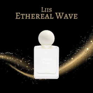 May include: A square, clear glass perfume bottle with a white spherical cap. The bottle has a white label with the text "Liis Ethereal Wave". The background is black with gold glitter accents.