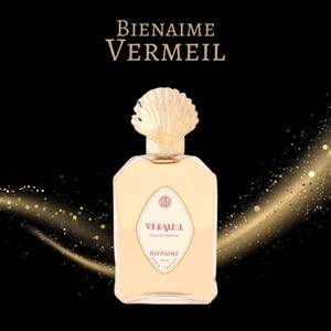 May include: A rectangular perfume bottle with a light yellow liquid and a seashell-shaped cap. The bottle has a label with the text "VERMEIL EAU DE PARFUM" and "BIENAIME PARIS FRANCE". The background is black with gold sparkles.