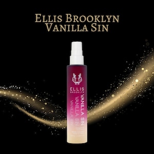 May include: A perfume bottle with a white spray nozzle and a gradient color scheme of red to beige. The bottle has the text "ELLIS BROOKLYN VANILLA SIN" and a logo. The background is black with gold glitter.