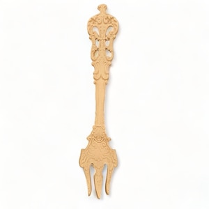 May include: A gold-colored ornate fork with a decorative handle. The fork has a detailed design with intricate swirls and curves.
