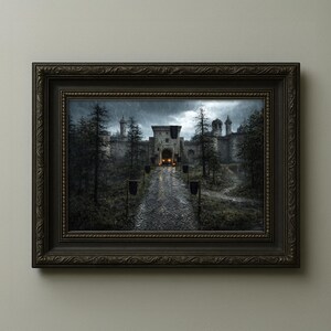 May include: A framed print depicting a medieval castle scene. The artwork shows a stone castle with a gate, a cobblestone road, and tall trees. The sky is overcast, and the scene is dark and moody.