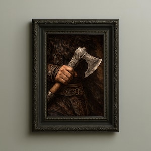 May include: Framed artwork featuring a detailed depiction of a hand firmly gripping a silver axe. The axe head has intricate carvings, and the handle is wrapped in a textured material. The artwork is set in a dark, moody environment.