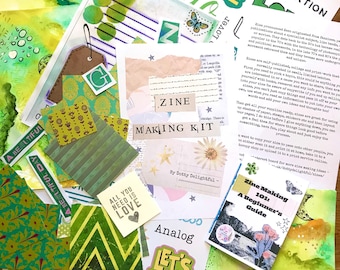 May include: A collection of green and white paper ephemera, including patterned paper, tags, and stickers. The image features the text "ZINE MAKING KIT" and a small booklet titled "Zine Making 101: A Beginner's Guide". The theme is DIY crafting.