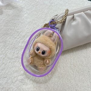 Oshi Shiny Pouch Mini-Vitrine für Plüschtiere, transparent, staubdicht, mit Reißverschluss, für Figuren und Puppen