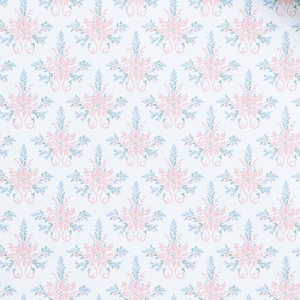 May include: A white fabric featuring a repeating pattern of light pink floral clusters and soft blue-green leafy sprigs arranged in a symmetrical, vertical design. The delicate botanical motifs are evenly spaced across the surface.