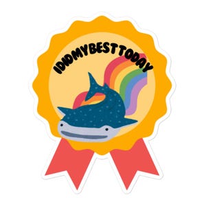 May include: A yellow and red sticker with a rainbow and a whale shark. The sticker says "I did my best today".