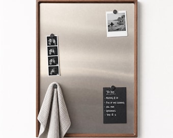 May include: A rectangular magnetic board with a dark wood frame and a brushed metal surface. It features a vertical photo strip, a landscape photograph, and a black note with the text To-Do, Meeting @ 10, Pick up dry cleaning, Call mom, Groceries, Yoga @ 6.