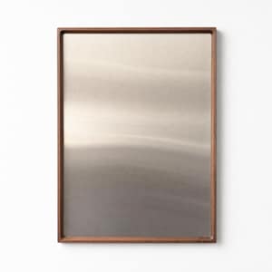 Empty walnut-framed magnetic board with a brushed stainless steel surface against a white wall.