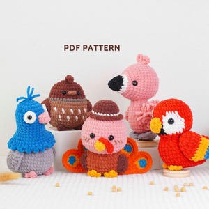 May include: A collection of five colorful, crocheted bird figures. The birds include a blue pigeon, a brown owl, a pink flamingo, a turkey, and a red parrot. The text "PDF PATTERN" is visible in the image.