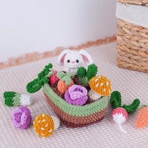 May include: A handmade crochet set featuring a white bunny in a brown, green, and beige basket filled with colorful crochet vegetables. The vegetables include carrots, radishes, and mushrooms. The set is designed for children.