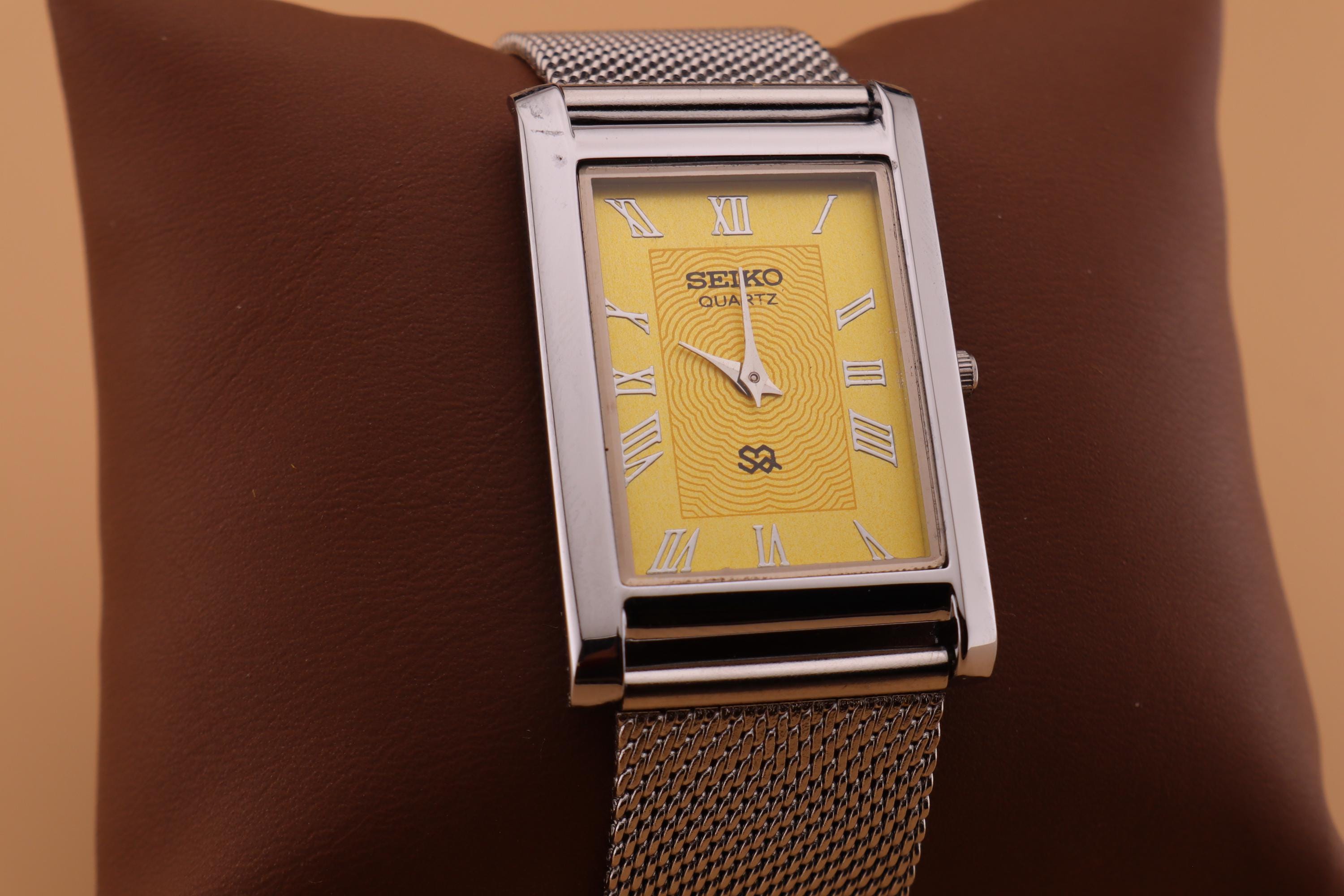 Dialed for Distinction Yellow Dial and Silver Case, Paired With a