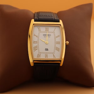 Power in simplicity Seiko Slim Vintage Barrel Tank Quartz Men's Wrist Watch With White Dial and New Black Strap
