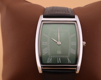 Crafted with precision Seiko Slim Vintage Barrel Tank Quartz Men's Wrist Watch With Green Dial and Black Strap