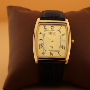 Legacy in every detail Seiko Slim Vintage Barrel Tank Quartz Men's Wrist Watch With Gold Dial and New Black Strap