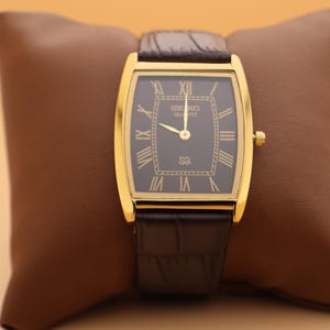 Montre-bracelet à quartz Seiko Slim vintage Barrel Tank pour homme avec cadran noir et nouveau bracelet marron foncé