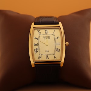 Always in style Seiko Slim Vintage Barrel Tank Quartz Men's Wrist Watch With Gold Dial and New Dark Brown Strap
