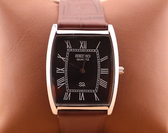 Crafted with precision Seiko Slim Vintage Barrel Tank Quartz Men's Wrist Watch With Black Dial and New Dark Brown Strap