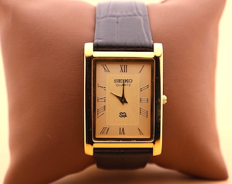 Montre à quartz vintage Seiko mince et élégante pour homme avec boîtier en or - Cadran doré avec nouveau bracelet en cuir noir