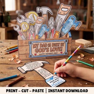 Puede incluir: Una caja de herramientas de papel con recortes de martillo, sierra, llave inglesa y taladro, con el texto "MY DAD IS BUILT BY GOD'S LOVE! HAPPY FATHER'S DAY!". Un recorte de papel en forma de martillo con texto se colorea con un lápiz arcoíris.