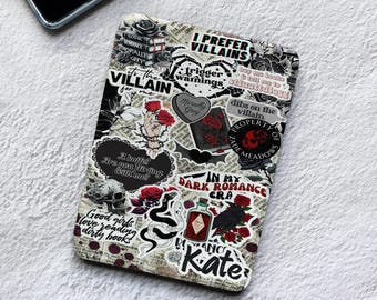May include: A rectangular e-reader cover featuring a collage of black, white, and red stickers with gothic themes. Text includes I PREFER VILLAINS, IN MY DARK ROMANCE ERA, and A knife? Are you flirting with me? alongside illustrations of skulls, roses, and snakes.