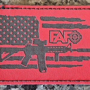 May include: A red leather patch with a black silhouette of an assault rifle, an American flag, and the text "F.A.F.O." with a target symbol.