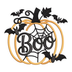 May include: A Halloween-themed design featuring a pumpkin shape with the word "Boo" in black script. The pumpkin is outlined in gold, with a black stem, leaves, and a spider web. Black bats are scattered around the pumpkin.