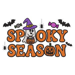 May include: A Halloween-themed design with the words "Spooky Season" in orange, outlined letters. A ghost wearing a purple witch hat and holding a pumpkin bucket is in the center. Bats, spiders, and candy complete the design.
