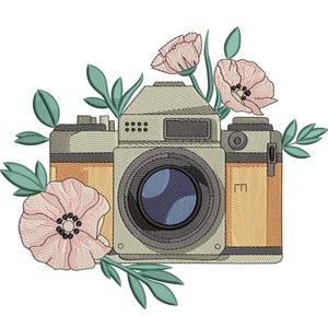 May include: An embroidered design featuring a vintage camera surrounded by pink flowers and green leaves. The camera has a beige body with orange and gray accents. The lens is dark blue.