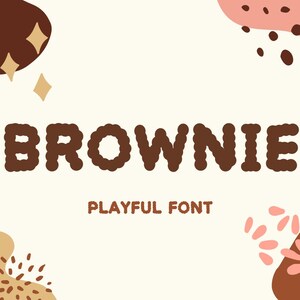 以下が含まれることがあります： 遊び心のある丸みを帯びたフォントで「BROWNIE」という文字が描かれたグラフィックデザイン。テキストは濃い茶色で、茶色、ピンク、タン色の抽象的な形が配置されたクリーム色の背景に配置されています。「PLAYFUL FONT」という文字が下に表示されています。
