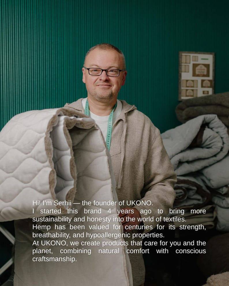 May include: A man wearing glasses and a light gray hoodie holds a white and beige quilted blanket. The text on the image reads: "Hi! I'm Serhii - the founder of UKONO... combining natural comfort with conscious craftsmanship."