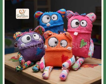 May include: Four plush monster toys in purple, blue, orange, and pink. Each features large white button eyes, stitched mouths, and patterned fabric limbs. The Sweet Onion Art Studio logo is visible in the top left corner of the image.