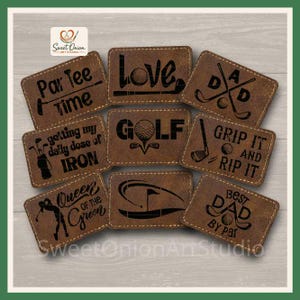 May include: A collection of eight rectangular brown leather patches with rounded corners, each featuring laser-engraved golf-themed designs and text including Par Tee Time, Love Golf, Dad, Getting My Daily Dose of Iron, Grip It and Rip It, Queen of the Green, and Best Dad By Par.