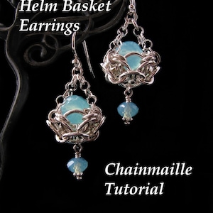 May include: Silver chainmail earrings with a light blue gemstone in the centre of each earring. The earrings are hanging from silver hooks. The text "Helm Basket Earrings" and "Chainmail Tutorial" is visible in the image.
