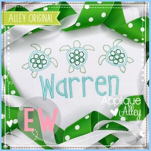 May include: White fabric with three embroidered green sea turtles and the name "Warren" in blue thread. The text "Applique Alley" is also embroidered in green and pink.