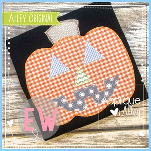 May include: Applique design of a pumpkin with a gingham pattern, a stitched smile, and eyes. The design is on a black fabric background. The text "Applique Alley" is visible in the lower right corner.