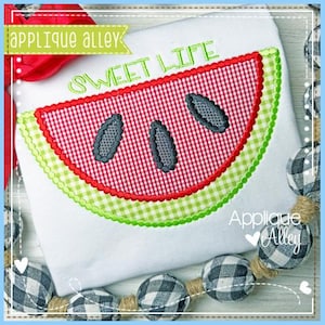 May include: White t-shirt with a watermelon design. The watermelon slice features a red and white gingham pattern, green rind, and gray seeds. The text "SWEET LIFE" is embroidered in green. The brand name "Applique Alley" is also visible.
