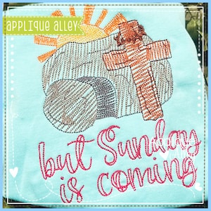 May include: Embroidered design on a light blue fabric featuring a stone with a cross on top, a sun, and the text "but Sunday is coming".